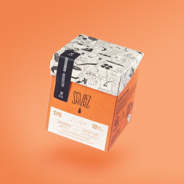Produktbild Kapselbox der Sorte SYD vor orangenem Hintergrund.