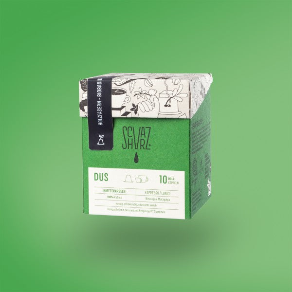 Produktbild Kapselbox der Sorte DUS vor grünem Hintergrund.